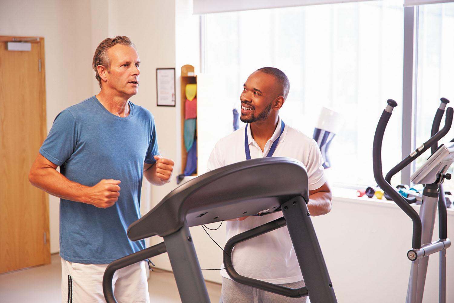 Patient Using Treadmill In Hospital Physiotherapy Department